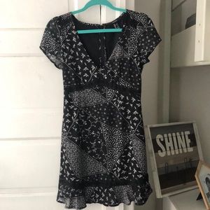 Black mini dress with floral pattern and lace